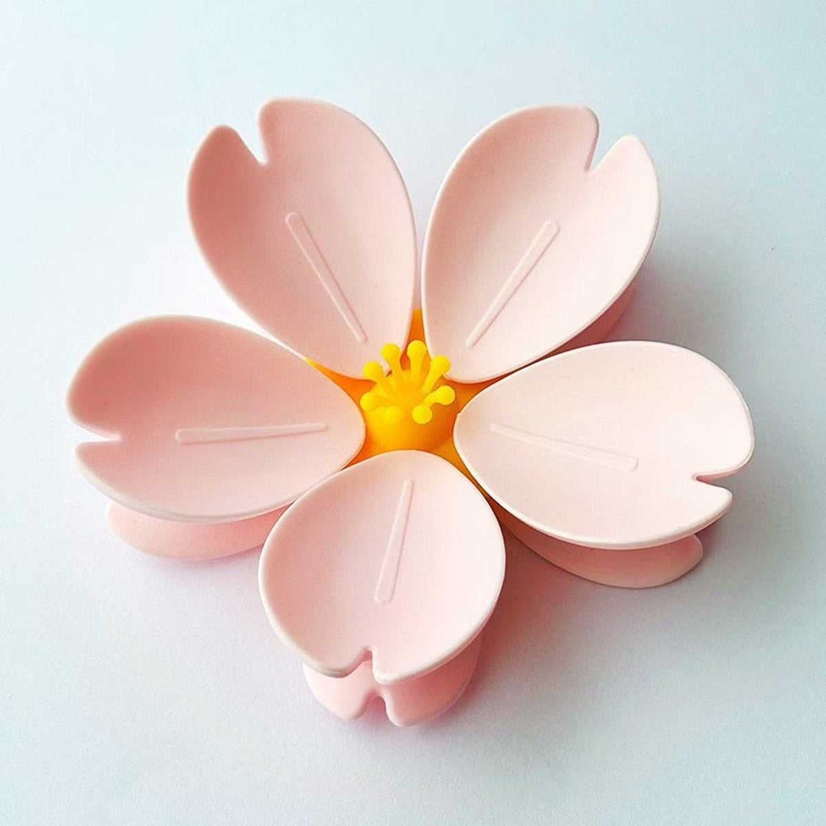 Close-up of decorative flower design on reusable magnetic bag clip