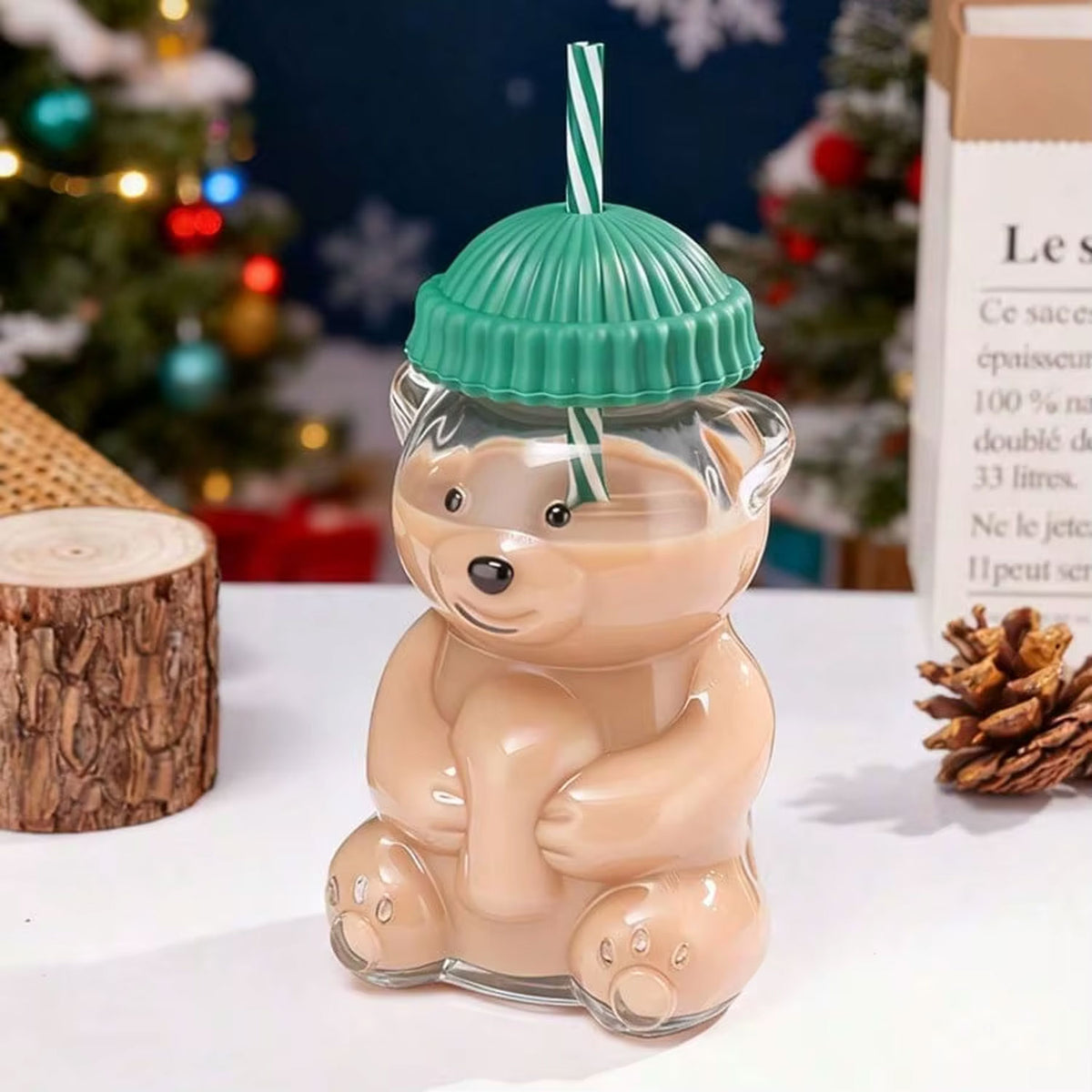 Close-up of cute bear shaped glass sipper with decorative top hat cap