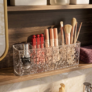 Four separate sections of a makeup brush storage holder
