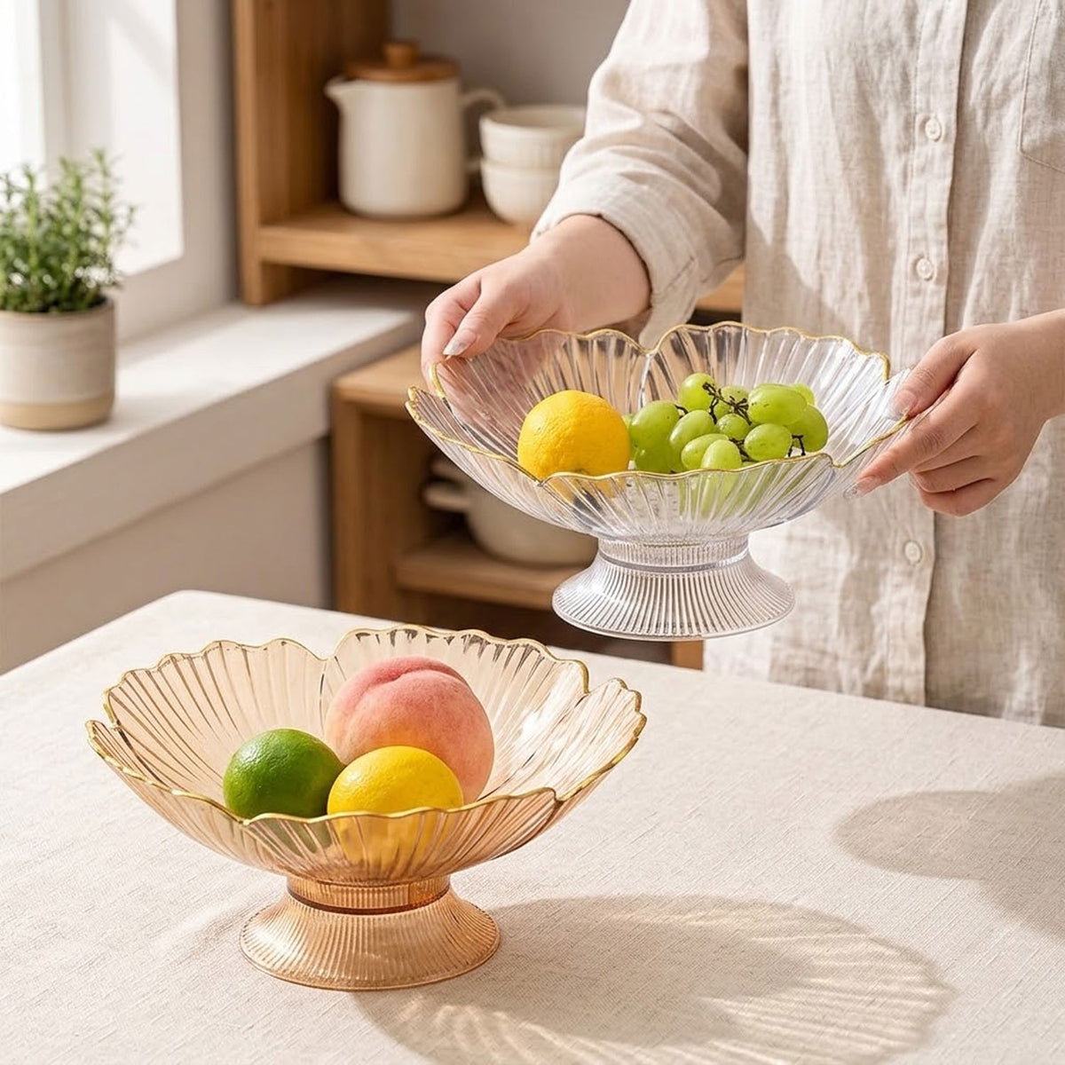 Fresh fruit arranged in a decorative kitchen bowl on a countertop