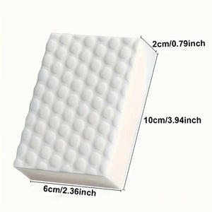 Water-dampened magic cleaning sponge removing scuff marks from a washable surface