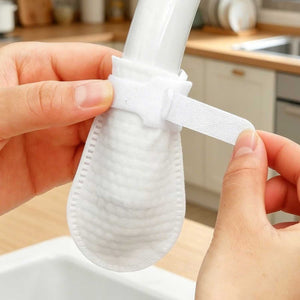 Cotton faucet filter cover fitted over a kitchen tap outlet