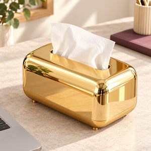 Top and side view of the gold tissue box beside a laptop on a home-office desk